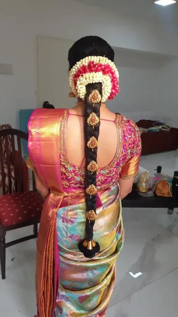 Bridal hairstyle by Makeup Niranjana — jadai-billai and traditional Chennai hair styling