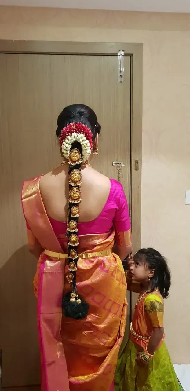 Bridal hairstyle by Makeup Niranjana — jadai-billai and traditional Chennai hair styling